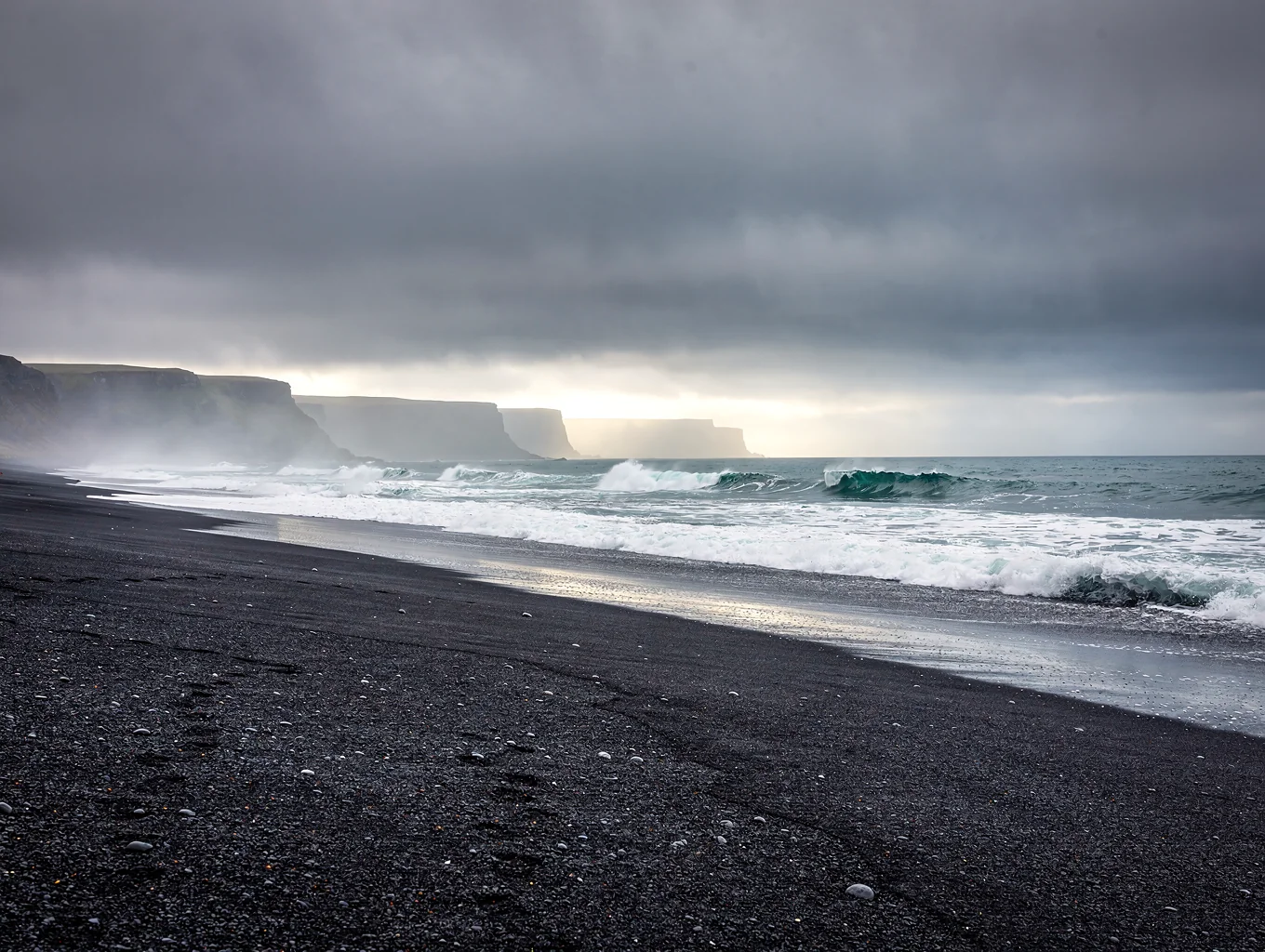 Glacial ice on black sand beach